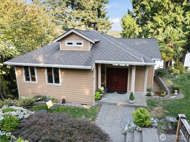 14407 Goodrich Dr NW, Gig Harbor, WA 98329 - view of front of home featuring roof with shingles and a front lawn