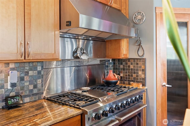 14407 Goodrich Dr NW, Gig Harbor, WA 98329 - kitchen with extractor fan, backsplash, and high end stove