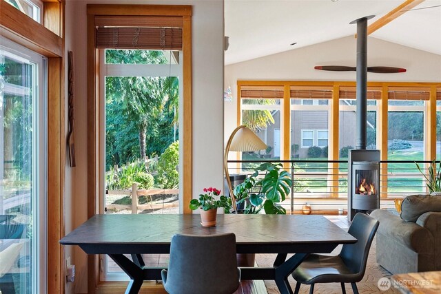 14407 Goodrich Dr NW, Gig Harbor, WA 98329 - dining space featuring a wood stove and lofted ceiling