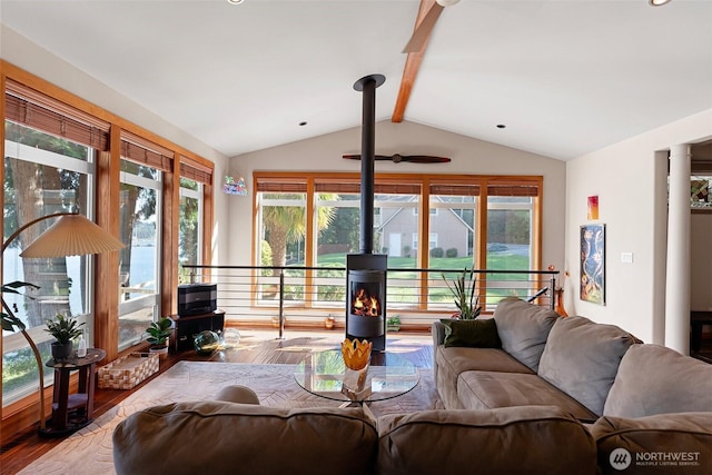 14407 Goodrich Dr NW, Gig Harbor, WA 98329 - living area featuring ceiling fan, vaulted ceiling with beams, and wood finished floors