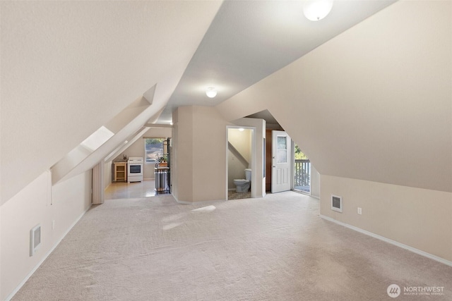 14407 Goodrich Dr NW, Gig Harbor, WA 98329 - bonus room featuring visible vents, vaulted ceiling, and carpet floors