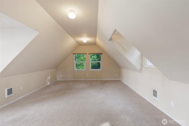 14407 Goodrich Dr NW, Gig Harbor, WA 98329 - bonus room featuring baseboards, vaulted ceiling, carpet, and visible vents