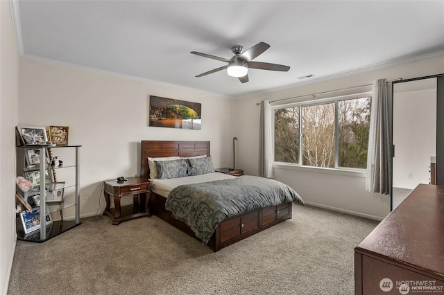 carpeted bedroom featuring ceiling fan, baseboards, crown molding, and visible vents