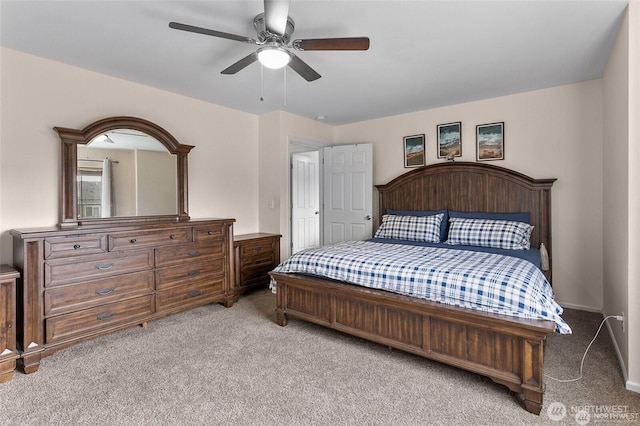 bedroom with a ceiling fan and light colored carpet