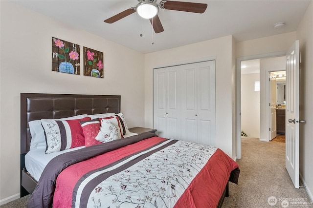 bedroom featuring a ceiling fan, carpet, and a closet