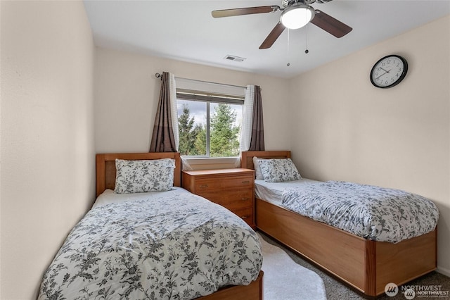 bedroom with a ceiling fan and visible vents