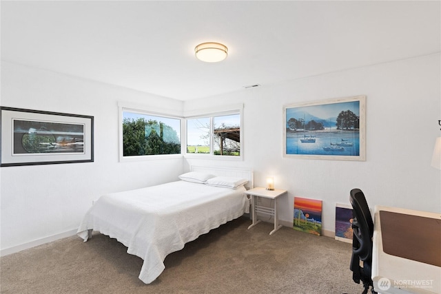 carpeted bedroom with baseboards and visible vents