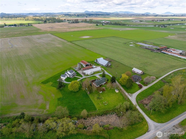 bird's eye view featuring a rural view and a mountain view