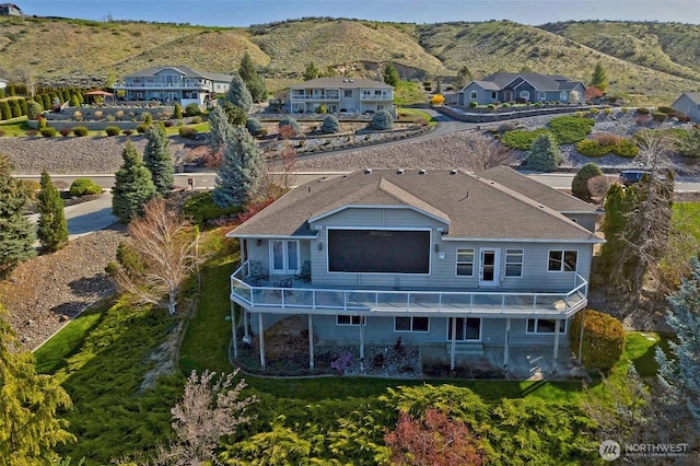 birds eye view of property featuring a mountain view