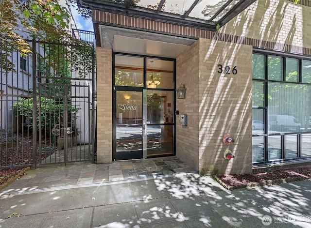 326 Queen Anne Ave N Unit 502, Seattle, WA 98109 - entrance to property with fence and brick siding
