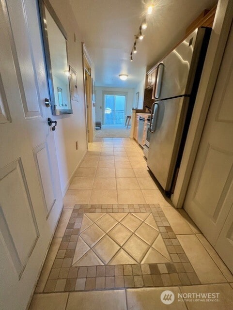 326 Queen Anne Ave N Unit 502, Seattle, WA 98109 - hall featuring baseboards and light tile patterned flooring