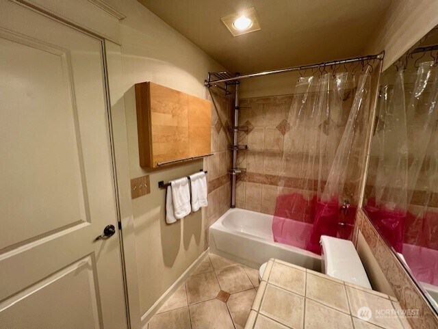 326 Queen Anne Ave N Unit 502, Seattle, WA 98109 - bathroom featuring tile patterned floors and shower / bath combination