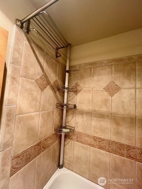 326 Queen Anne Ave N Unit 502, Seattle, WA 98109 - bathroom featuring a washtub and walk in shower