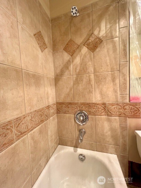 326 Queen Anne Ave N Unit 502, Seattle, WA 98109 - bathroom featuring a shower and a tub