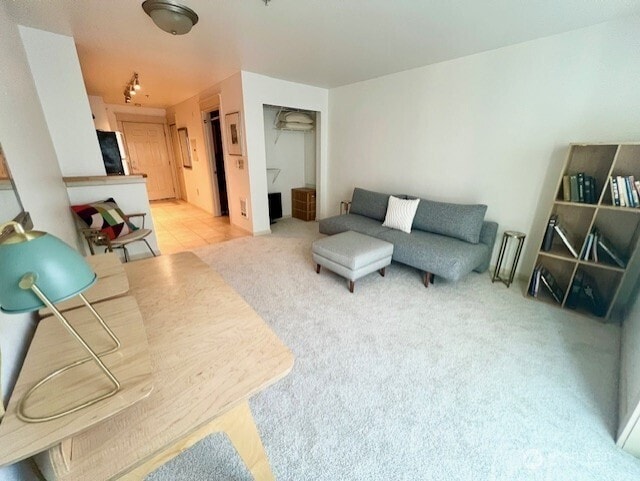 326 Queen Anne Ave N Unit 502, Seattle, WA 98109 - living room featuring light colored carpet