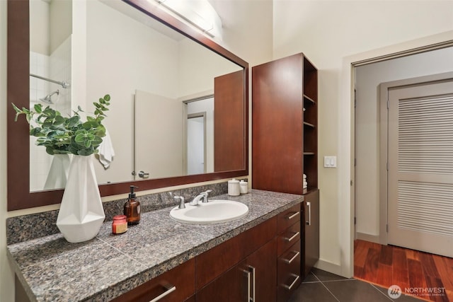 bathroom with vanity and tile patterned flooring