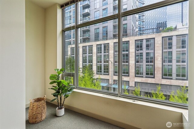 details with a view of city, carpet flooring, and baseboards