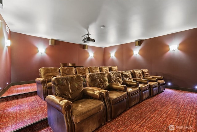 carpeted home theater with baseboards