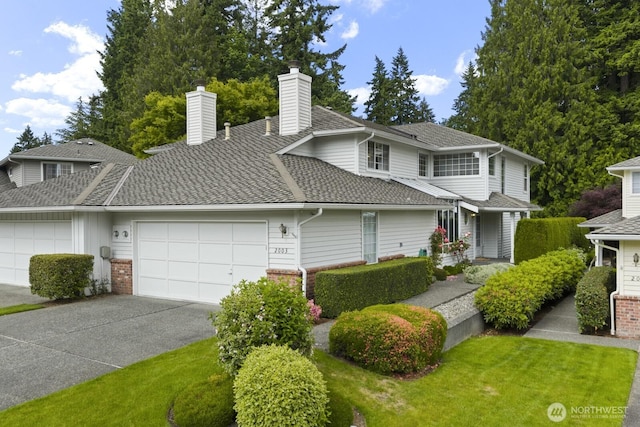 2003 Mill Pointe Dr SE, Mill Creek, WA 98012 - view of front facade featuring a garage, driveway, brick siding, a chimney, and a front lawn