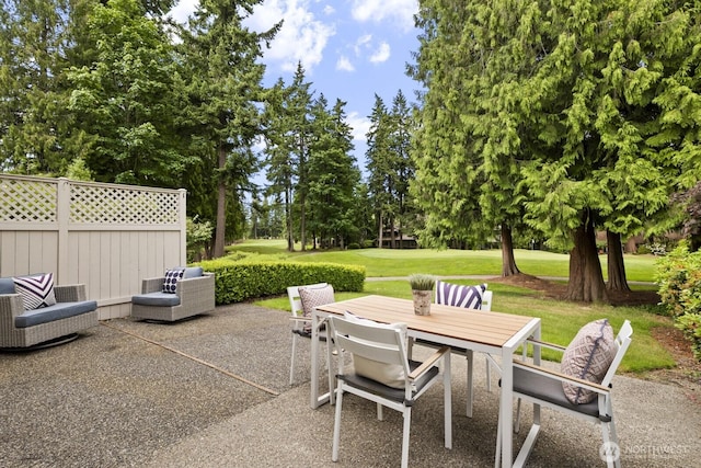 2003 Mill Pointe Dr SE, Mill Creek, WA 98012 - view of patio with outdoor dining space and view of scattered trees