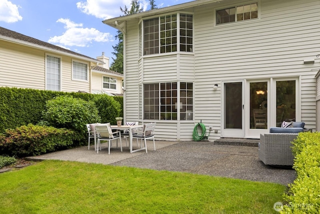 2003 Mill Pointe Dr SE, Mill Creek, WA 98012 - rear view of house featuring a patio and a yard