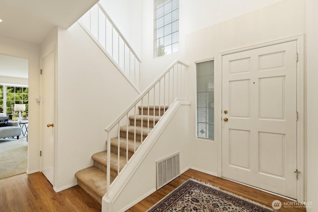 2003 Mill Pointe Dr SE, Mill Creek, WA 98012 - foyer featuring stairway, wood finished floors, and baseboards