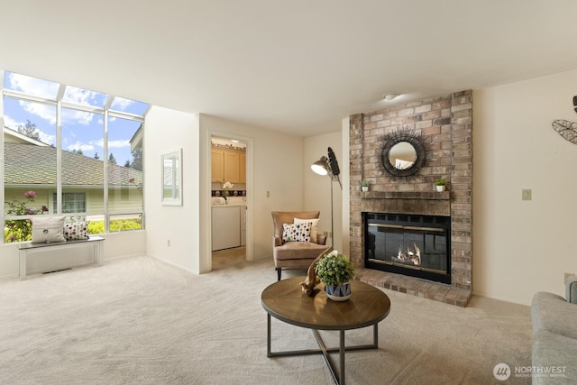 2003 Mill Pointe Dr SE, Mill Creek, WA 98012 - carpeted living room with separate washer and dryer and a brick fireplace