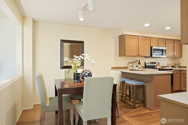 2003 Mill Pointe Dr SE, Mill Creek, WA 98012 - dining area with light wood finished floors and recessed lighting