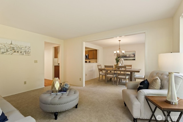 2003 Mill Pointe Dr SE, Mill Creek, WA 98012 - living area featuring a chandelier and light carpet