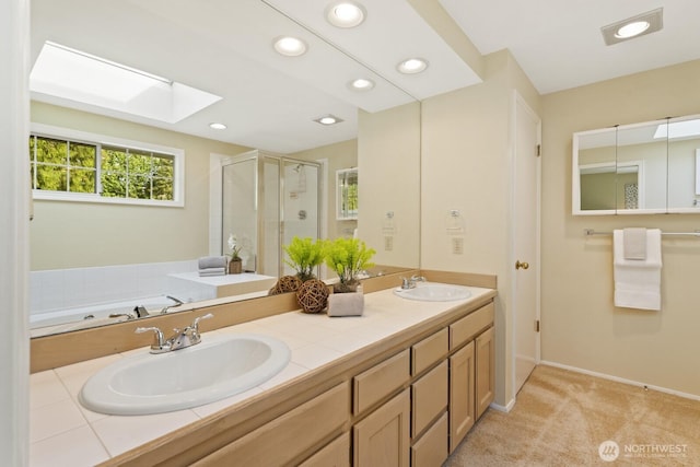2003 Mill Pointe Dr SE, Mill Creek, WA 98012 - bathroom with a shower stall, double vanity, recessed lighting, a skylight, and baseboards