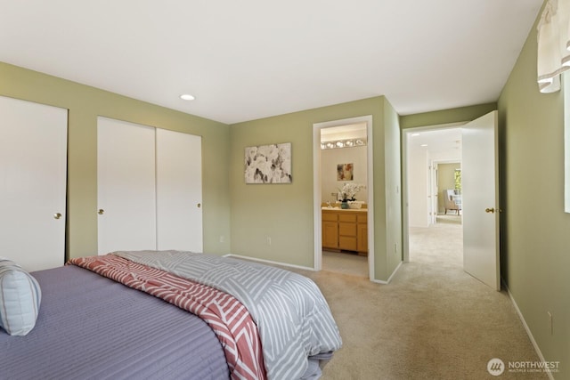 2003 Mill Pointe Dr SE, Mill Creek, WA 98012 - bedroom with light carpet, baseboards, and ensuite bath