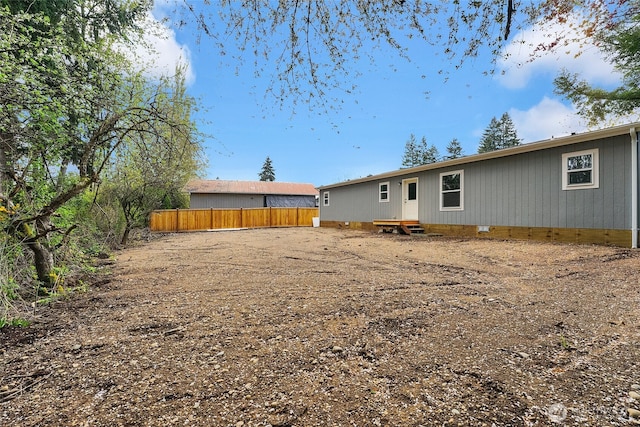 13105 Ridge Cir E, Bonney Lake, WA 98391 - back of property with fence and crawl space