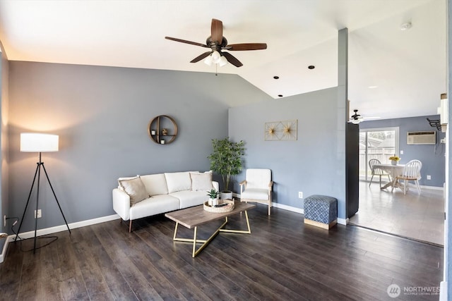 living area featuring baseboards, a wall unit AC, and ceiling fan