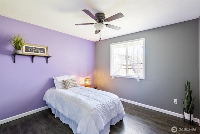 bedroom featuring baseboards, ceiling fan, and wood finished floors