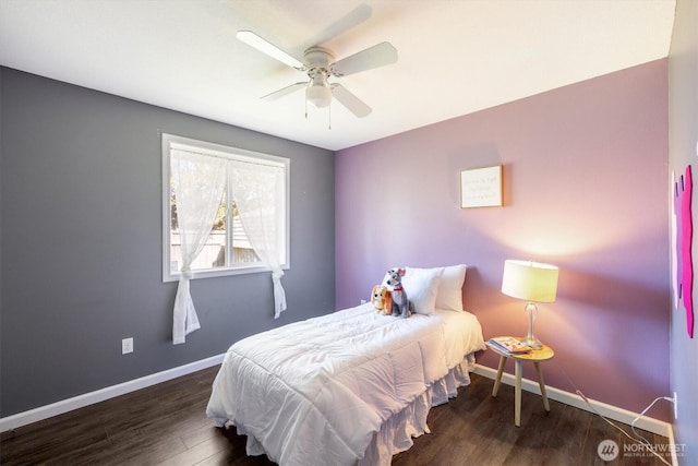 bedroom featuring ceiling fan, baseboards, and wood finished floors