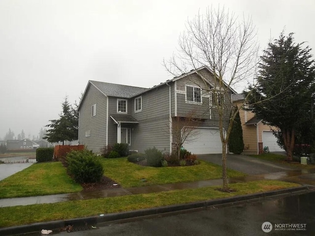 16109 SE 258th St, Covington, WA 98042 - traditional home with an attached garage, a front lawn, and aphalt driveway