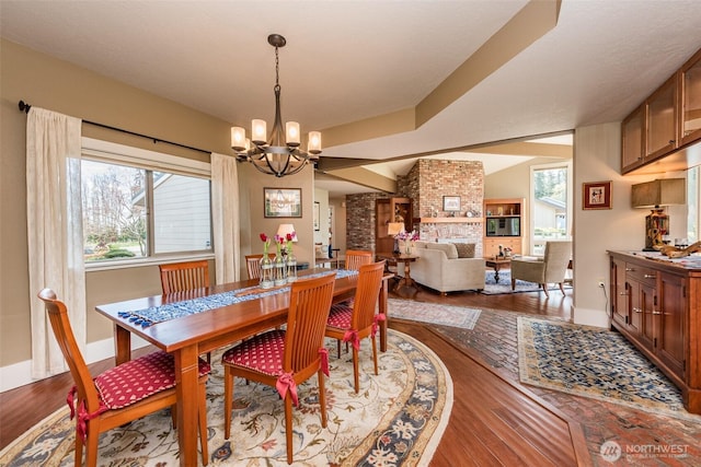 6250 Woodcock Rd, Sequim, WA 98382 - dining space featuring a chandelier and wood finished floors