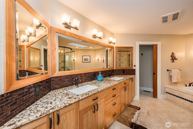 6250 Woodcock Rd, Sequim, WA 98382 - bathroom featuring tasteful backsplash, a garden tub, double vanity, tile patterned floors, and a shower with shower door