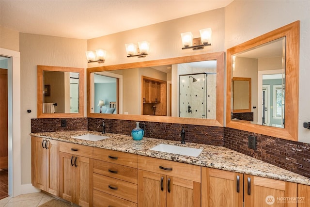 6250 Woodcock Rd, Sequim, WA 98382 - full bath with tasteful backsplash, a stall shower, double vanity, and tile patterned flooring