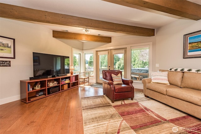 6250 Woodcock Rd, Sequim, WA 98382 - living area featuring wood finished floors and beamed ceiling