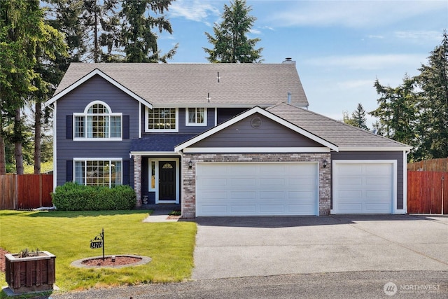 24214 38th Avenue Ct E, Spanaway, WA 98387 - traditional-style home featuring driveway, an attached garage, roof with shingles, and a chimney