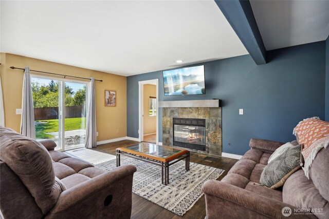 24214 38th Avenue Ct E, Spanaway, WA 98387 - living room with baseboards, a tiled fireplace, dark wood-style floors, and recessed lighting