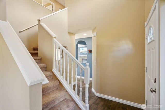 24214 38th Avenue Ct E, Spanaway, WA 98387 - foyer with dark wood-style flooring, baseboards, stairway, and a high ceiling