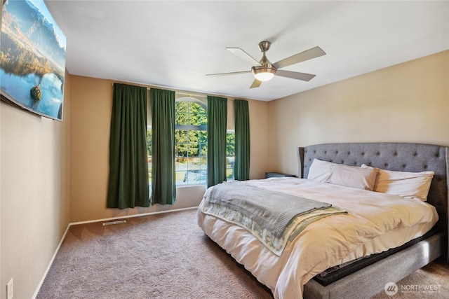 24214 38th Avenue Ct E, Spanaway, WA 98387 - carpeted bedroom with baseboards and a ceiling fan