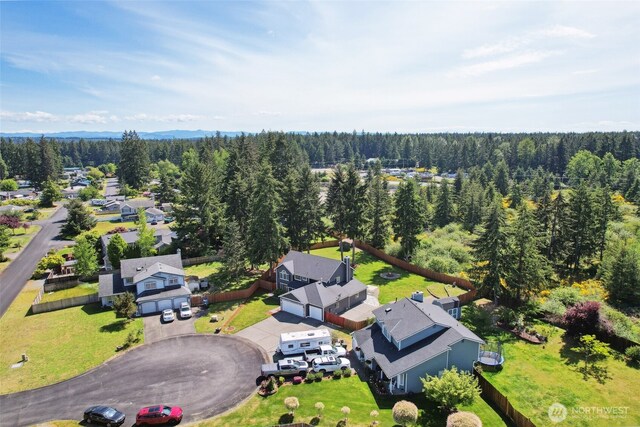 24214 38th Avenue Ct E, Spanaway, WA 98387 - aerial perspective of suburban area featuring a heavily wooded area