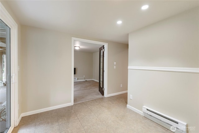 unfurnished room with baseboard heating, baseboards, light carpet, recessed lighting, and light tile patterned flooring