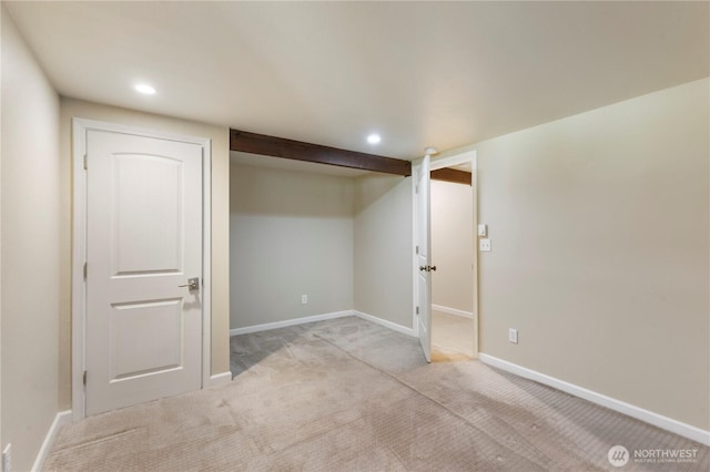 finished basement with recessed lighting, baseboards, and light carpet