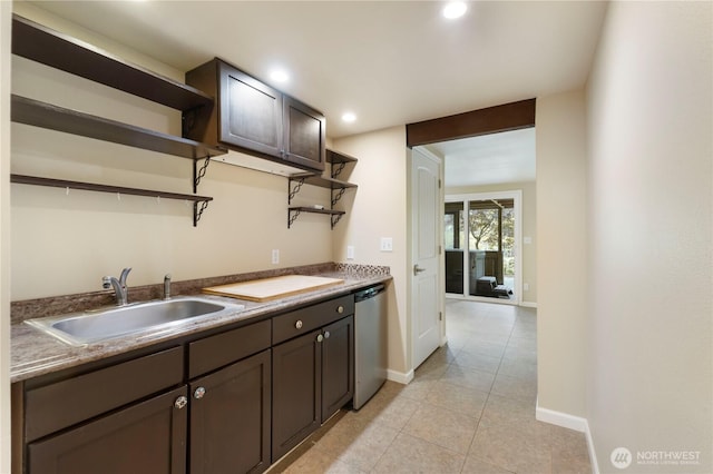kitchen featuring a sink, stainless steel dishwasher, open shelves, and dark brown cabinetry