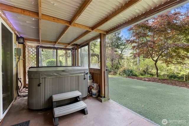 view of patio / terrace with a hot tub