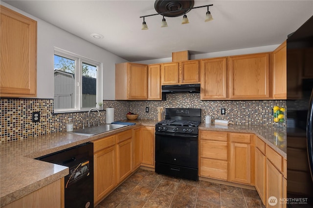 kitchen with a sink, stone finish floor, decorative backsplash, under cabinet range hood, and black appliances